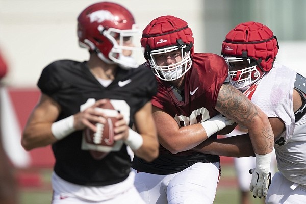 Arkansas defensive lineman John Ridgeway rushes the quarterback at practice on Tuesday, Aug. 24, 2021 in Fayetteville.