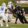 Arkansas State defensive lineman Terry Hampton (97) chases after Memphis quarterback Seth Henigan (14) during the first quarter of the Red Wolves' 55-50 loss on Saturday, Sept. 11, 2021, at Centennial Bank Stadium in Jonesboro. .(Arkansas Democrat-Gazette/Thomas Metthe)