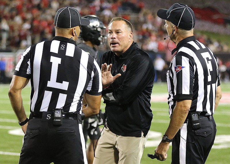 Arkansas State head coach Butch Jones discusses a call with officials during the fourth quarter of the Red Wolves' 55-50 loss on Saturday, Sept. 11, 2021, at Centennial Bank Stadium in Jonesboro. .(Arkansas Democrat-Gazette/Thomas Metthe)