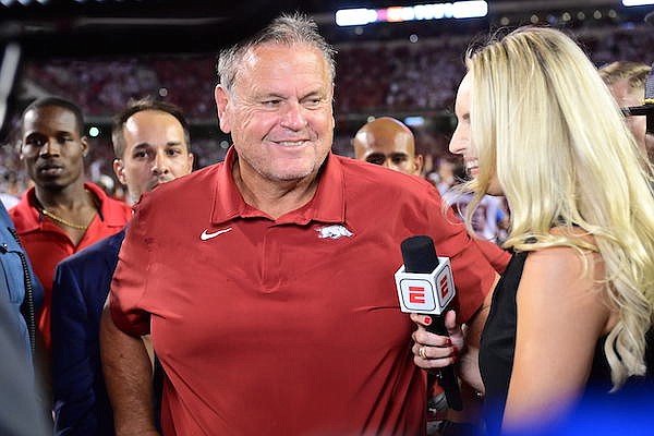 Arkansas coach Sam Pittman speaks with ESPN reporter Katie George following a 40-21 victory over Texas on Saturday, Sept. 11, 2021, in Fayetteville.
