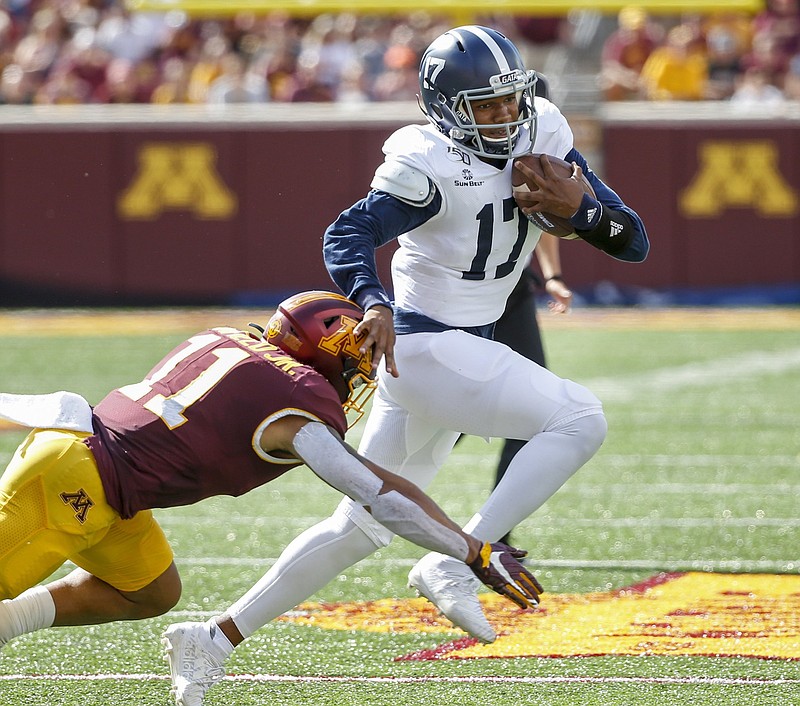 Minnesota linebacker Thomas Barber (41) tackles Georgia Southern quarterback Justin Tomlin (17) in the first quarter of an NCAA college football game Saturday, Sept. 14, 2019, in Minneapolis. (AP Photo/Bruce Kluckhohn)