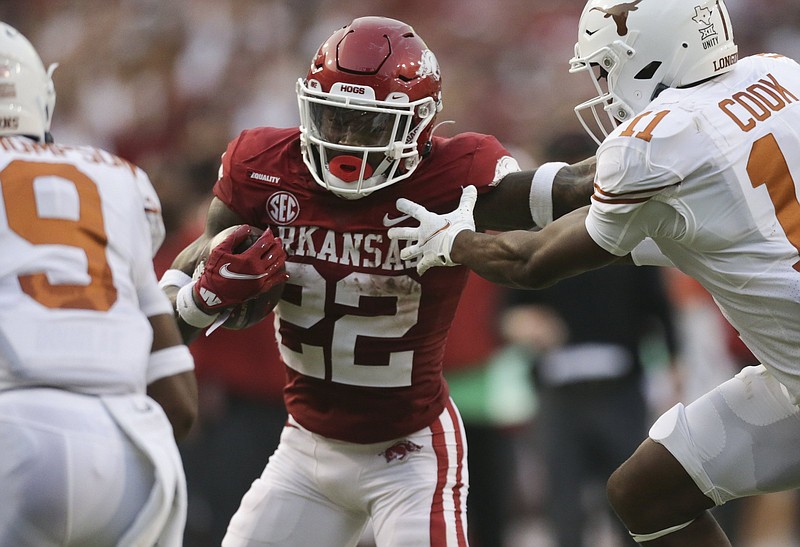 Trelon Smith, who leads the Razorbacks in rushing with 177 yards through the first two games, is among a group of backs who have helped Arkansas establish a run-heavy offense. The No. 20 Razorbacks, who host Georgia Southern on Saturday, are ranked ninth in the nation in rushing with 289 yards per game.
(NWA Democrat-Gazette/Charlie Kaijo)