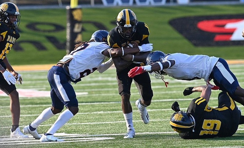 UAPB quarterback Skyler Perry keeps the ball and tries to break a tackle from Lane College during a Sept. 4 win. (Special to The Commercial/Darlena Roberts)