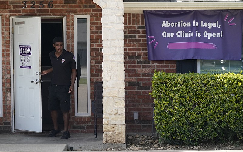 A security guard opens the door to the Whole Women’s Health Clinic in Fort Worth on Sept. 1. Video online at arkansasonline.com/916texas/.
(AP)