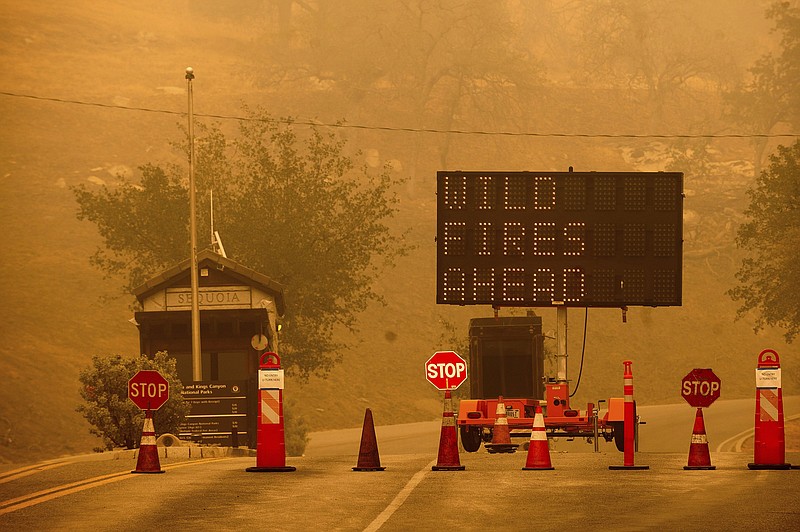 Cones block the entrance to California’s Sequoia National Park on Wednesday as the KNP Complex Fire burns nearby.
(AP/Noah Berger)
