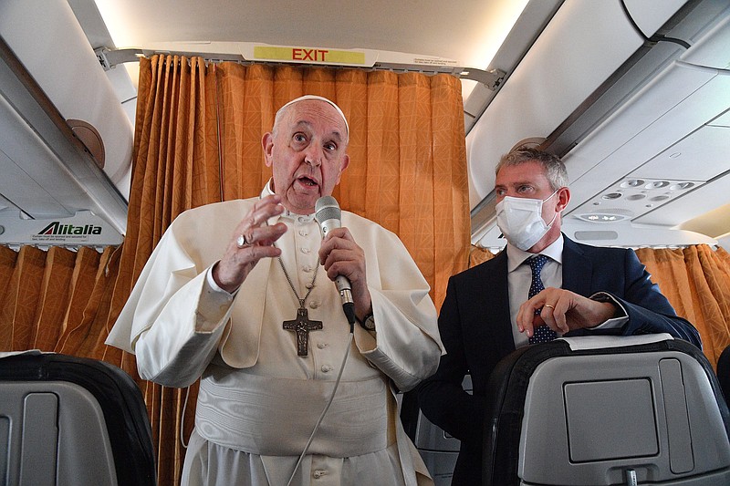 Pope Francis speaks with journalists on board an Alitalia aircraft enroute from Bratislava back to Rome on Wednesday after a fourday pilgrimage to Hungary and Slovakia.
(AP/Tiziana Fabi)