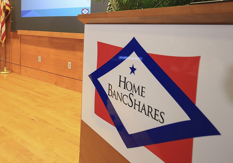 The logo for Home BancShares Inc., which does business in Arkansas as Centennial Bank, is shown during a press conference in Little Rock in this March 2017 file photo. (Arkansas Democrat-Gazette/Staton Breidenthal)