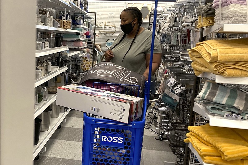 A shopper looks at merchandise at a retail store in Morton Grove, Ill., in this file photo. Americans continued to shop in August with retail sales rising 0.7% in August from July, the Commerce Department said Thursday.
(AP)