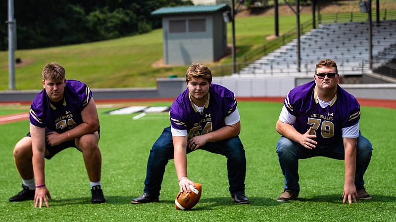 Ozark offensive linemen Brock Burns (from left), R.J. Karnes and Bryan Yates have been instrumental in the Hillbillies success up front. The Hillbillies resume their annual Franklin County Feud against Charleston today.
(Special to the NWA Democrat-Gazette/David Beach)