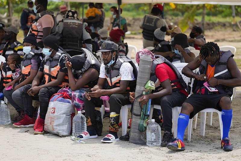 Haitian migrants prepare to board boats in Necocli, Colombia, on Monday, Sept. 13, 2021. Migrants have been gathering in Necocli as they move north to Acandi, near Colombia's border with Panama, on their journey to the U.S. border. (AP/Fernando Vergara)