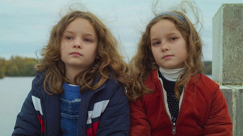 After her grandmother Marion dies, Nelly (Josephine Sanz) makes friends with another 8-year-old also named Marion (played by Josephine’s sister Gabrielle Sanz) in Celine Sciamma’s charming “Petite Maman,” one of the early hits of the ongoing Toronto International Film Festival.