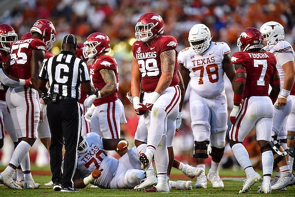 Arkansas defensive tackle John Ridgeway (99) celebrates a tackle during a game against Texas on Saturday, Sept. 11, 2021, in Fayetteville.