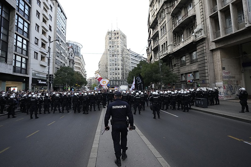 Serbian police officers stand ready Saturday as demonstrators take the streets in Belgrade to protest potential new coronavirus restrictions announced by the government.
(AP/Darko Vojinovic)