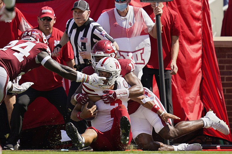 Nebraska quarterback Adrian Martinez (2) is brought down by Oklahoma linebacker Nik Bonitto (11) and linebacker Brian Asamoah in the first half Saturday in Norman, Okla. The No. 3 Sooners held on to win 23-16 in the first matchup between the teams since 2010.
(AP/Sue Ogrocki)