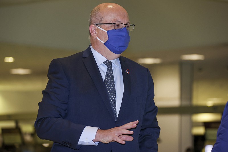 France’s Ambassador to Australia Jean-Pierre Thebault arrives Saturday at Sydney Airport.
(AP/David Gray)