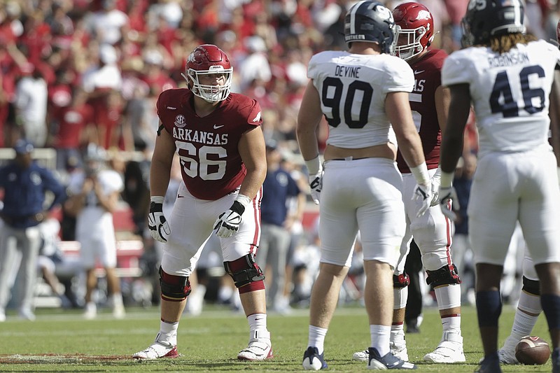 Arkansas offensive lineman Ty Clary (left) lines up at right tackle during the first half Saturday afternoon against Georgia Southern. Clary played three positions on the offensive line Saturday because of injuries to starters Dalton Wagner at right tackle and Ricky Stromberg at center. He also played at right guard.
(NWA Democrat-Gazette/Charlie Kaijo)