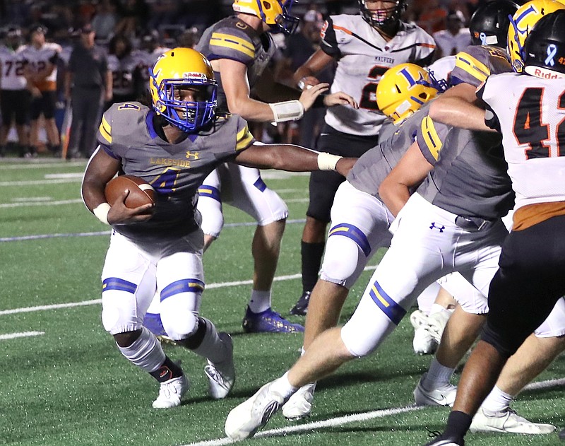 Lakeside's Chance Cross (4) follows blockers for a gain against Malvern Friday, September 17, 2021. Photo by Richard Rasmussen of The Sentinel-Record