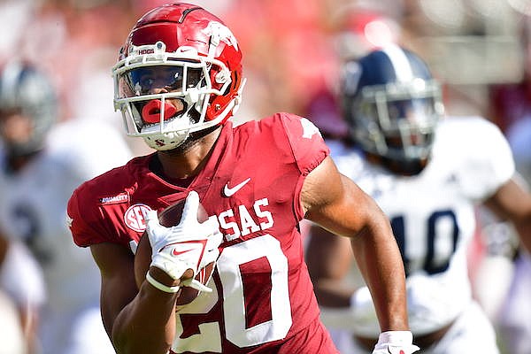 Arkansas running back Dominique Johnson carries the ball during a game against Georgia Southern on Saturday, Sept. 18, 2021, in Fayetteville.