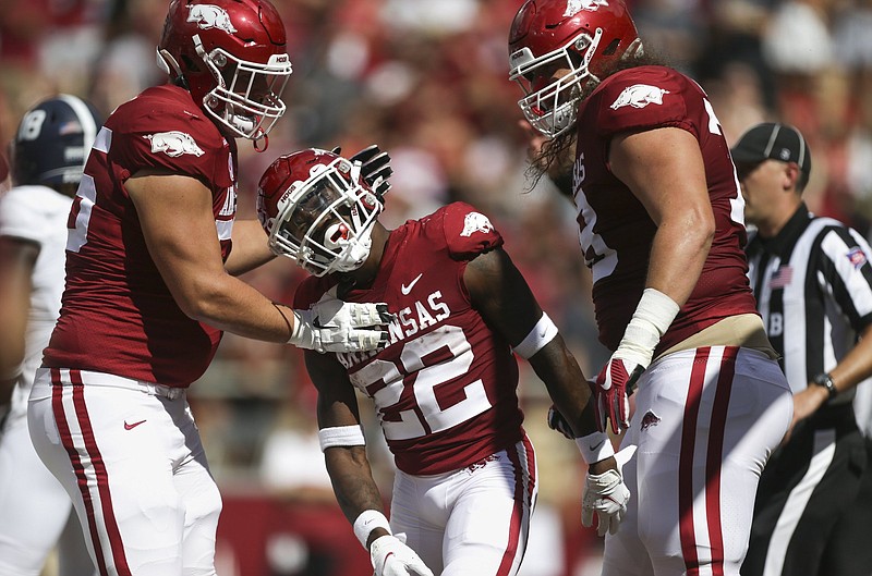 Arkansas running back Trelon Smith (22) reacts following a score, Saturday, September 18, 2021 during the first quarter of a football game at Reynolds Razorback Stadium in Fayetteville. Check out nwaonline.com/210919Daily/ for today's photo gallery. .(NWA Democrat-Gazette/Charlie Kaijo)