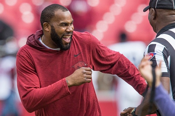 Darren McFadden, former Arkansas and NFL running back, laughs after the coin toss before a game against Auburn on Saturday, Oct. 19, 2019, at Reynolds Razorback Stadium in Fayetteville.