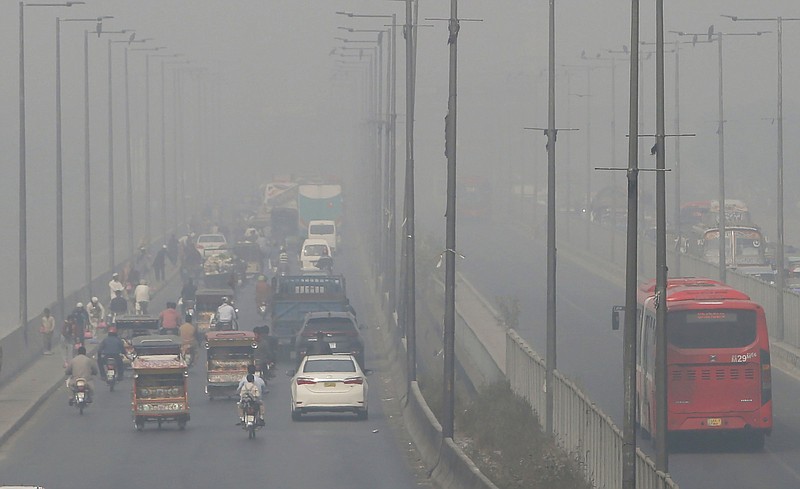 Vehicles drive on a highway on Wednesday, Nov. 11, 2020, as smog envelops the area of Lahore, Pakistan.
(AP/K.M. Chaudary)