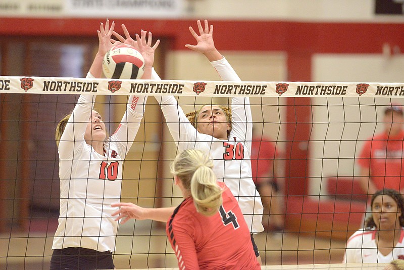 Fort Smith Northside's Bailee Brinkley (10) and Dynasty Andrews try to block a shot by Cabot's Jenna DeLaMater Tuesday Sept. 21, 2021 at Northside. The Grizzlies won the match 3-1 over Cabot. Visit nwaonline.com/210000922Daily/ (NWA Democrat-Gazette/J.T. Wampler)