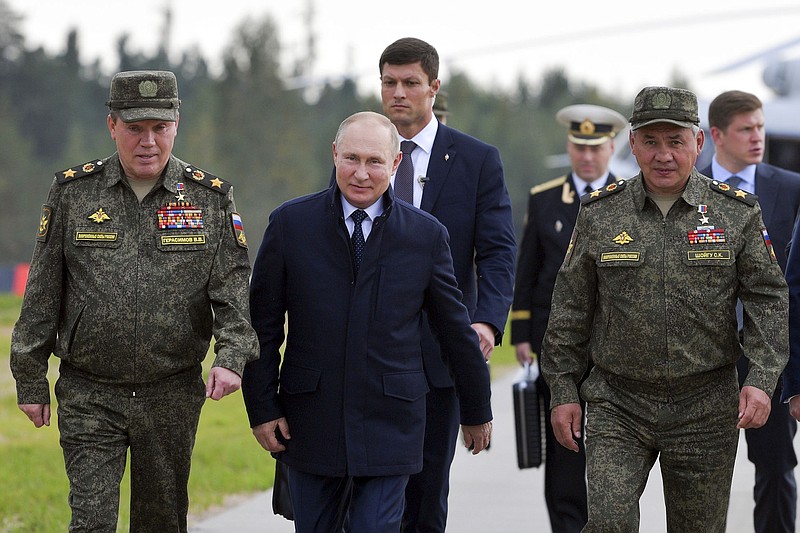 Russian President Vladimir Putin, Russian General Staff Valery Gerasimov (left) and Defense Minister Sergei Shoigu attend the joint strategic exercise of the armed forces of the Russian Federation and the Republic of Belarus Zapad-2021 on Monday at the Mulino training ground in the Nizhny Novgorod region of Russia.
(AP/Sputnik/Sergei Savostyanov)