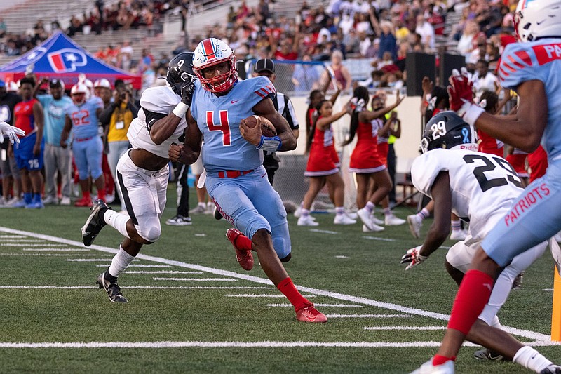 Parkview's Jaylon White, (middle) out runs White Hall?s defense leading to a touchdown for the Patriots Friday night at War Memorial Stadium in Little Rock. (Arkansas Democrat-Gazette/Justin Cunningham)