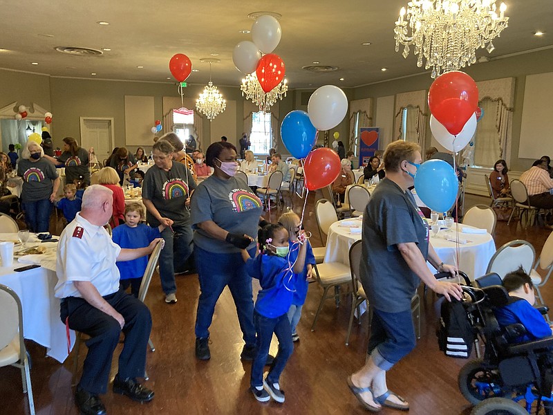 Children from Jenkins Memorial Center parade through a luncheon celebrating the kickoff of the 2021-2022 United Way fundraising campaign. 
(Pine Bluff Commercial/Byron Tate)