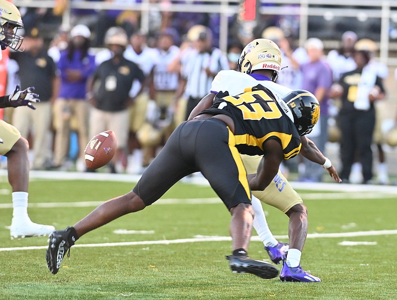 UAPB linebacker Isaac Peppers (53) forces a fumble by Alcorn State quarterback Felix Harper during first-quarter action Thursday at Simmons Bank Field. 
(Special to The Commercial/Darlena Roberts)