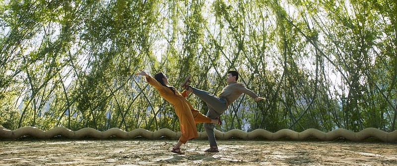 Ying Li (Fala Chen) trains her son Shang-Chi (Simu Liu) in “Shang-Chi and the Legend of the Ten Rings”