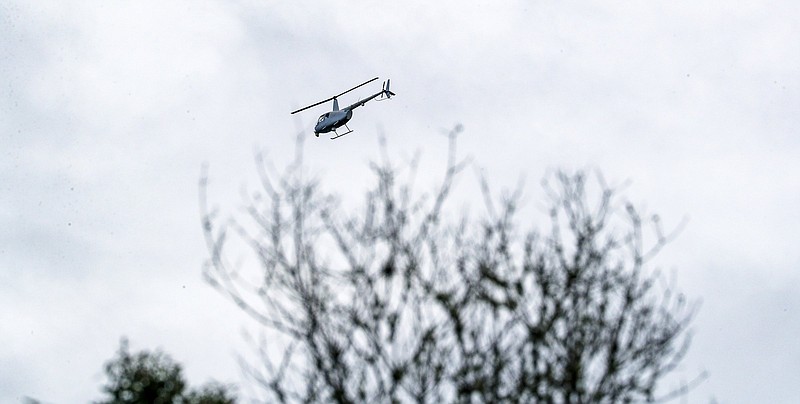 A helicopter aids crews from the FBI and North Port police and sheriff’s departments Wednesday as they search for Brian Laundrie at Carlton Reserve Park in Venice, Fla.
(AP/Naples Daily News/Andrea Melendez)