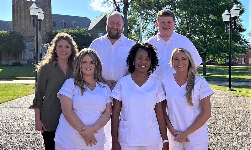 The University of Arkansas at Monticello nursing program achieved a 100% pass rate of the nursing board exam. Graduates include Tiffany Rogers (front row, from left), Melonie Williams, Taylor Day, Assistant Professor Joy Stringfellow of Monticello (back row, from left), Kristopher Kirby and Nicholas Colvin. 
(Special to The Commercial/University of Arkansas at Monticello)