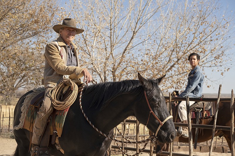 Old hand Mike Milo (Clint Eastwood) shows young Rafo (Eduardo Minett) how to be a cowboy in the Eastwood’s road movie “Cry Macho.”