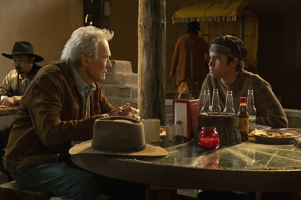 Stoic knight errant Mike Milo (Clint Eastwood) travels to Mexico to rescue Rafo (Eduardo Minett), the beer-drinking, cockfighting,13-year-old son of his former employer in “Cry Macho.”