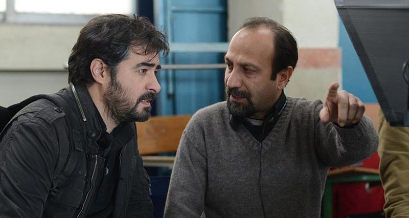 Iranian master filmmaker Asghar Farhadi (right) is seen here talking to actor Shahab Hosseini on the set of his 2018 film “The Salesman.” Farhadi’s latest film, “A Hero,” will be featured at the Arkansas Cinema Society’s Filmland event next week.
