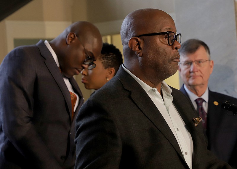 FILE - Little Rock City Attorney Tom Carpenter (right) watches Police Chief Keith Humphrey (center) speak during a March 16, 2020, news conference as Mayor Frank Scott Jr. (left) stands in the background. (Arkansas Democrat-Gazette file photo)