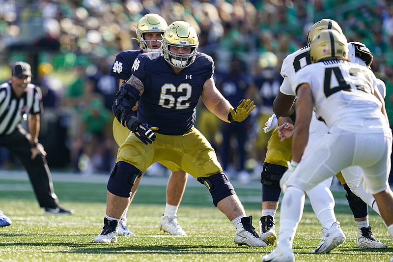 Notre Dame’s offensive line is in a state of transition as the No. 12 Fighting Irish prepare to take on No. 18 Wisconsin today at Soldier Field in Chicago.
(AP/Michael Conroy)