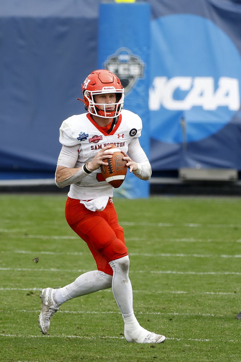 Quarterback Eric Schmid helped lead Sam Houston State to the NCAA Football Championship Subdivision national title last season. Schmid and the Bearkats take on Central Arkansas today in Conway.
(AP/Michael Ainsworth)