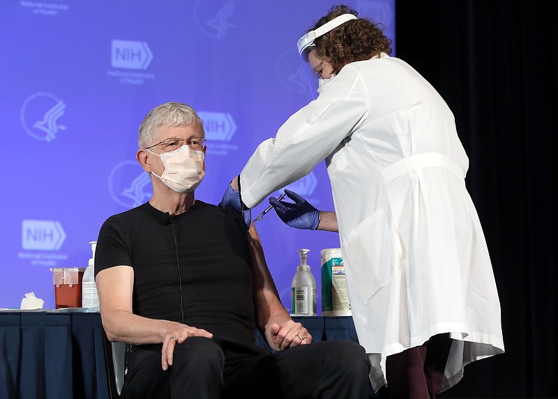 Dr. Francis Collins, National Institutes of Health director, receives the Moderna covid-19 vaccine at the HHS/NIH Covid-19 Vaccine Kickoff event at NIH in December.
(National Institutes of Health/Chiachi Chang)