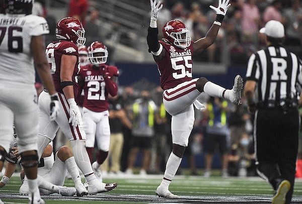 Arkansas defensive end Tre Williams (55) celebrates a sack during a game against Texas A&M on Saturday, Sept. 25, 2021, in Arlington, Texas.