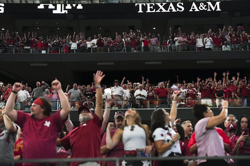 Arkansas fans cheer, Saturday, September 25, 2021 during the fourth quarter of a football game at AT&T Stadium in Arlington, Texas. Check out nwaonline.com/210926Daily/ for today's photo gallery. .(NWA Democrat-Gazette/Charlie Kaijo)