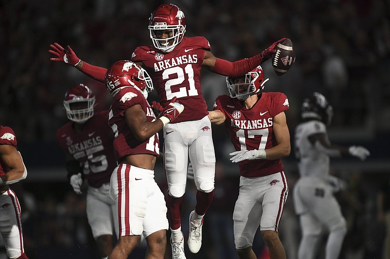 Arkansas defensive back Montaric Brown (21) intercepts the ball, Saturday, September 25, 2021 during the fourth quarter of a football game at AT&T Stadium in Arlington, Texas. Check out nwaonline.com/210926Daily/ for today's photo gallery. .(NWA Democrat-Gazette/Charlie Kaijo)