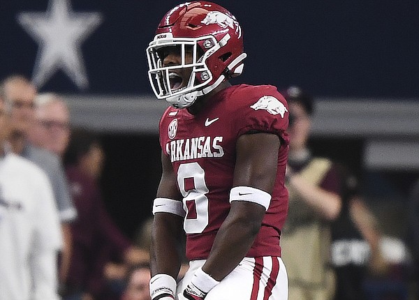 Arkansas safety Jayden Johnson celebrates during a game against Texas A&M on Saturday, Sept. 25, 2021, in Arlington, Texas.