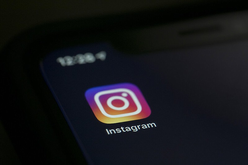 FILE - The Instagram app is displayed on a computer on Aug. 23, 2019, in New York. Instagram is putting a pause on its Instagram Kids platform, geared towards children under 13, so it can address concerns about accessibility and content. (AP/Jenny Kane, file)