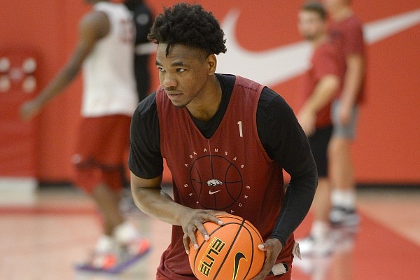 Arkansas guard JD Notae looks to pass Tuesday, Sept. 28, 2021, during practice in the university practice facility in Fayetteville.