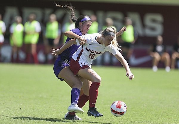 Arkansas' Anna Podojil (16) fights for possession during a game against Stephen F. Austin on Monday, Sept. 6, 2021, in Fayetteville.