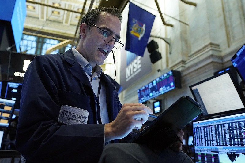 Trader Gregory Rowe works Wednesday on the floor of the New York Stock Exchange.
(AP/Richard Drew)