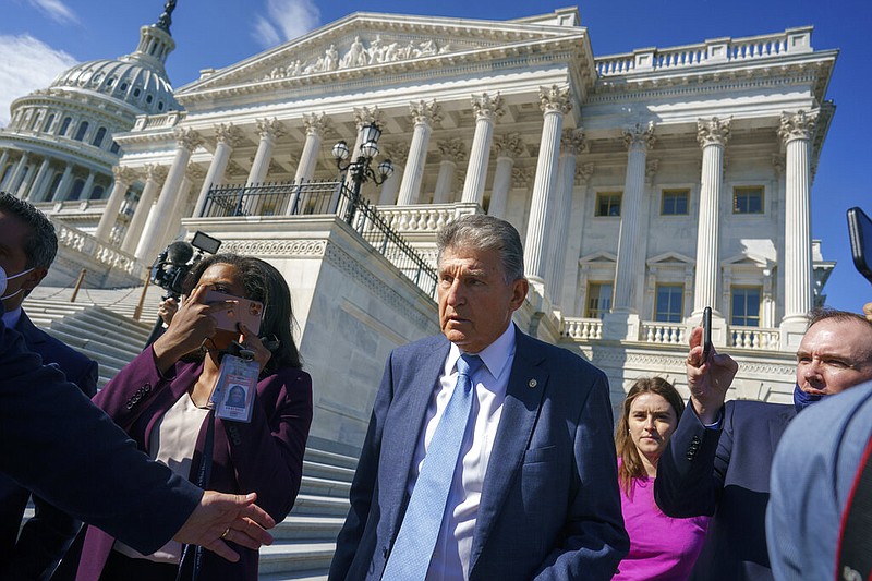 Sen. Joe Manchin, D-W.Va., a centrist Democrat vital to the fate of President Joe Biden's $3.5 trillion domestic agenda, is surrounded by reporters outside the Capitol in Washington, Wednesday, Sept. 29, 2021. (AP/J. Scott Applewhite)