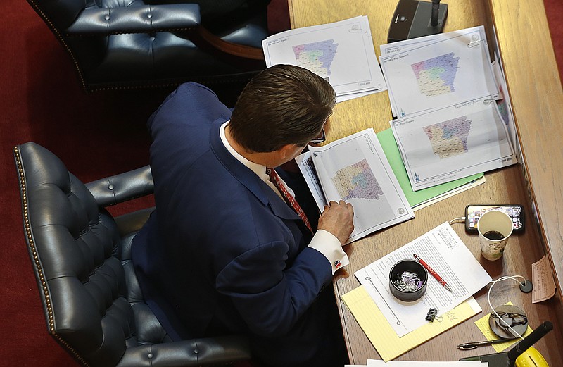 State Sen. Jason Rapert, R-Conway, looks over proposed congressional redistricting maps during the Senate session on Wednesday, Sept. 29, 2021, at the state Capitol in Little Rock. More photos at arkansasonline.com/930session/. (Arkansas Democrat-Gazette/Thomas Metthe)